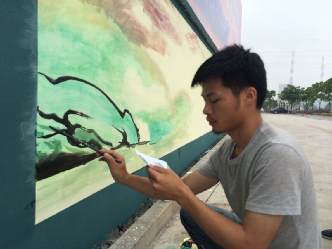 大学生手绘墙画 吃螃蟹自谋出路(图)